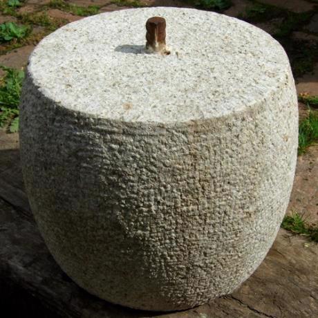 Granite, drum round, staddle stone with iron pin