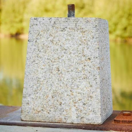 Granite, tapered square, staddle stone with iron pin