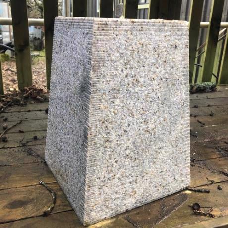 Granite, tapered square, staddle stone with iron pin