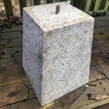 Granite, tapered square, staddle stone with iron pin